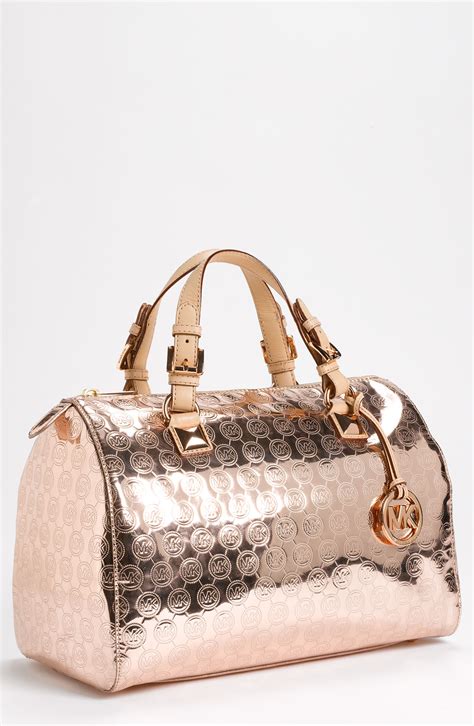 michael kors rose gold silver purses|Michael Kors gold evening bag.